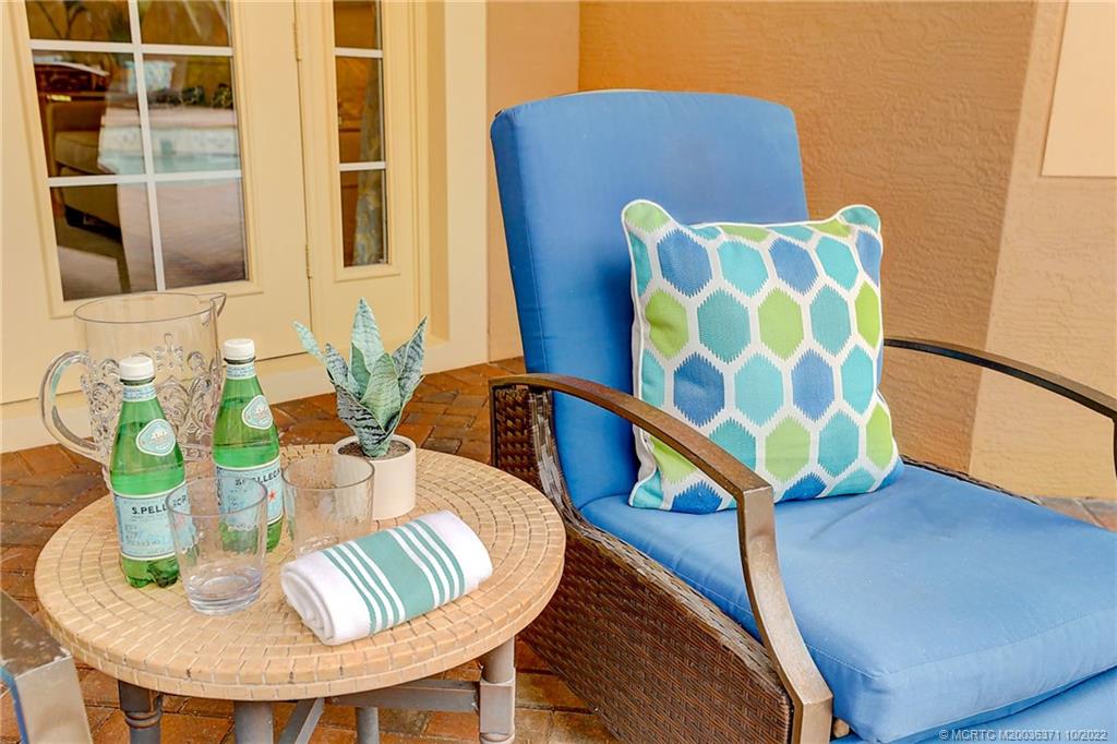 7426 Southeast Laque Circle Stuart, FL 34997 - Photo 16 of 81 a view of a dining room with furniture and wooden floor