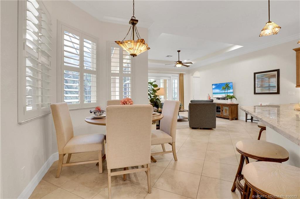7426 Southeast Laque Circle Stuart, FL 34997 - Photo 42 of 81 a view of a dining room with furniture window and outside view
