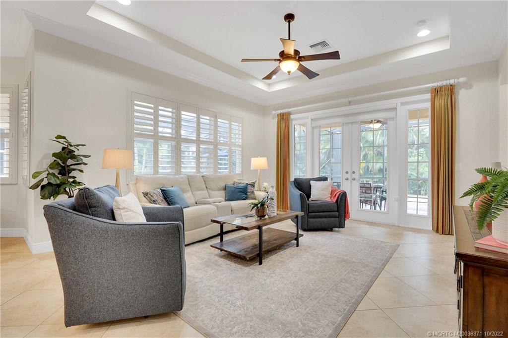 7426 Southeast Laque Circle Stuart, FL 34997 - Photo 43 of 81 a living room with furniture and a large window