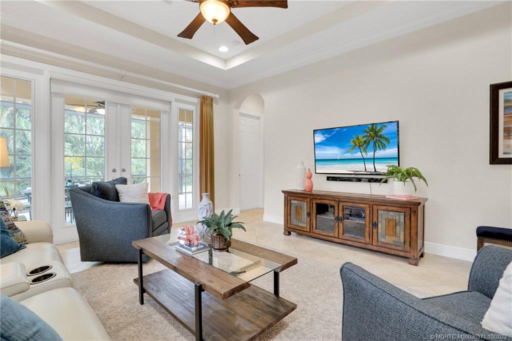 7426 Southeast Laque Circle Stuart, FL 34997 - Photo 45 of 81 a living room with furniture and a fireplace