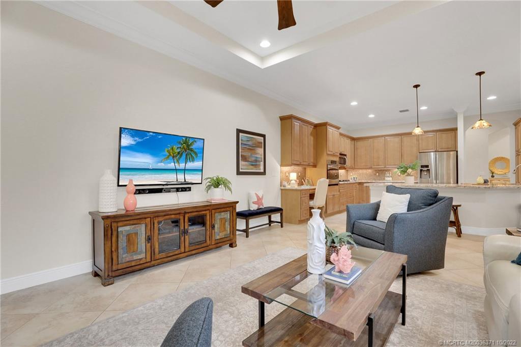 7426 Southeast Laque Circle Stuart, FL 34997 - Photo 46 of 81 a living room with furniture and a flat screen tv