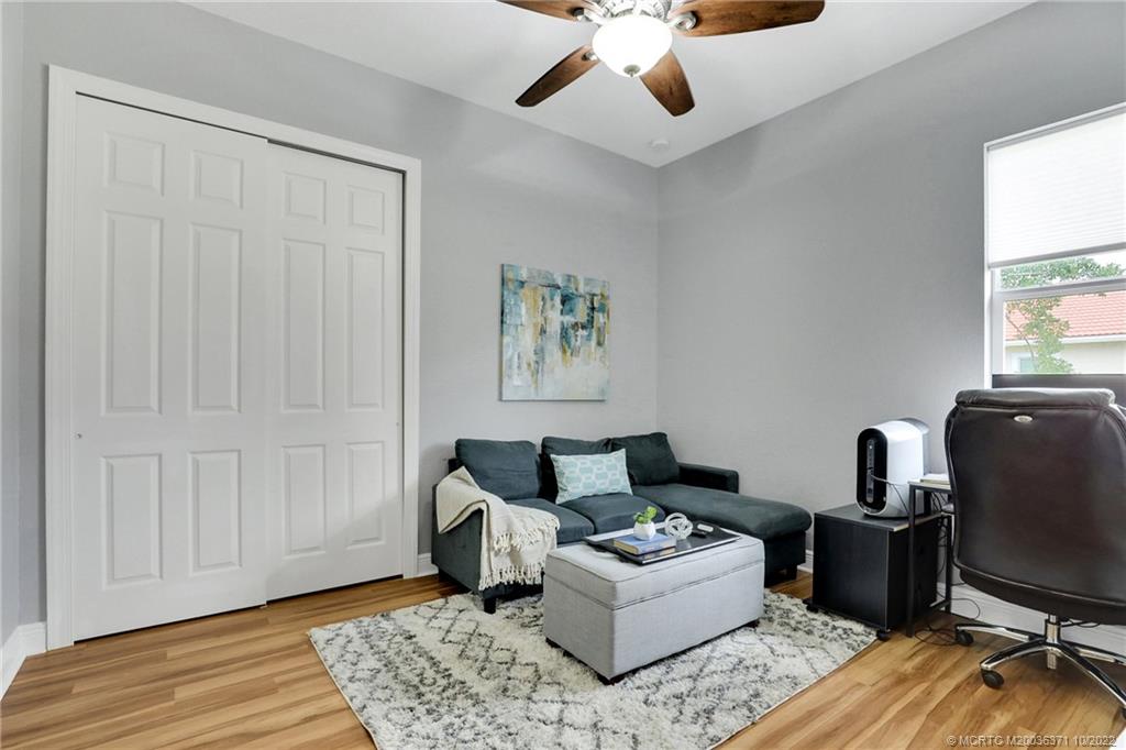 7426 Southeast Laque Circle Stuart, FL 34997 - Photo 63 of 81 a living room with furniture and a window