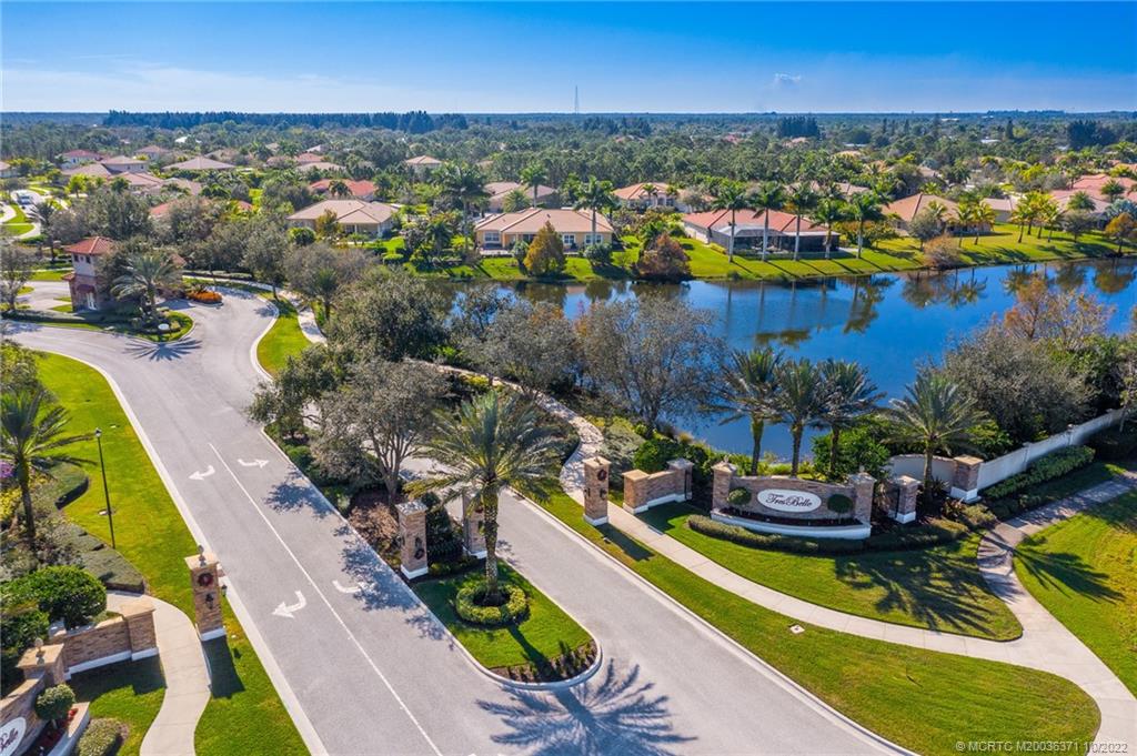 7426 Southeast Laque Circle Stuart, FL 34997 - Photo 81 of 81 an aerial view of a house with a swimming pool outdoor seating and yard