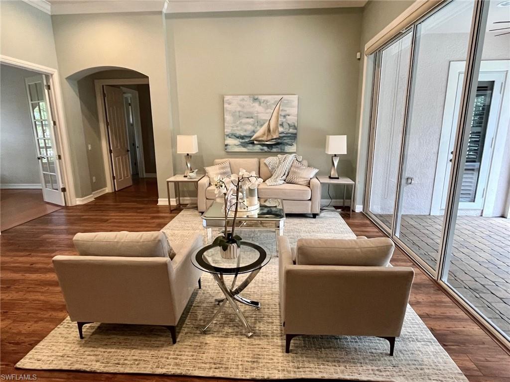 4956 Rustic Oaks Circle Naples, FL 34105 - Photo 11 of 37 a living room with furniture and a window