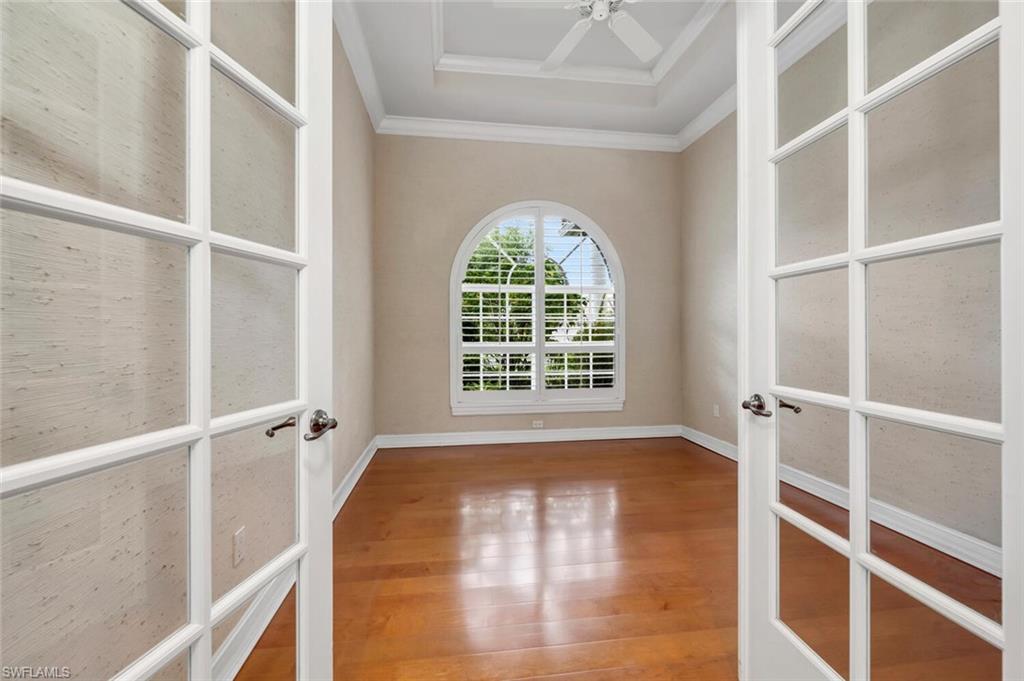 4956 Rustic Oaks Circle Naples, FL 34105 - Photo 23 of 37 a view of an empty room with a window