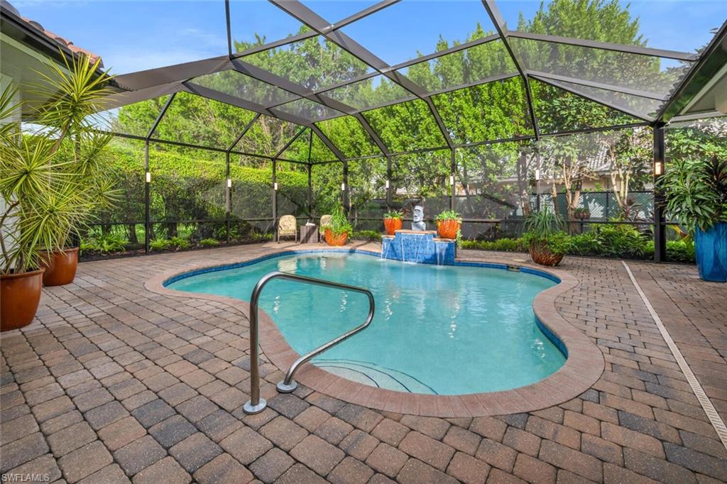 4956 Rustic Oaks Circle Naples, FL 34105 - Photo 25 of 37 a view of a swimming pool with a yard