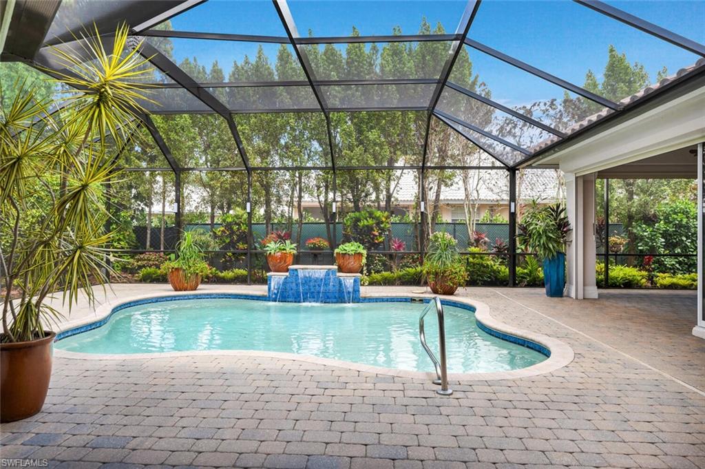 4956 Rustic Oaks Circle Naples, FL 34105 - Photo 26 of 37 a view of a swimming pool with a sitting space