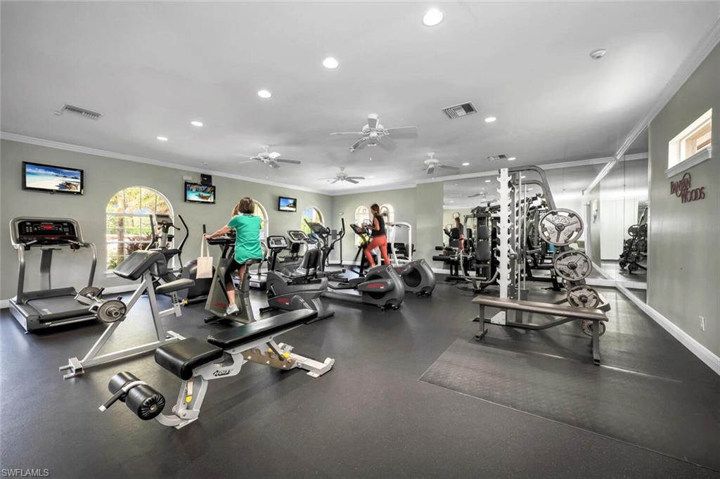 4956 Rustic Oaks Circle Naples, FL 34105 - Photo 27 of 37 a view of a room with gym equipment