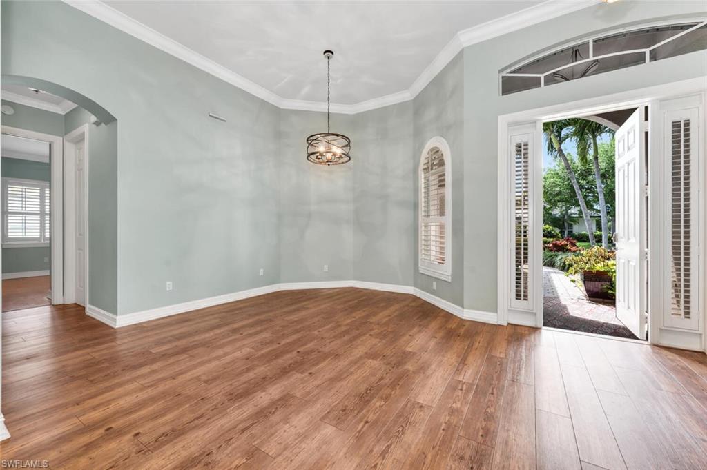 4956 Rustic Oaks Circle Naples, FL 34105 - Photo 33 of 37 a view of a livingroom with wooden floor and a window