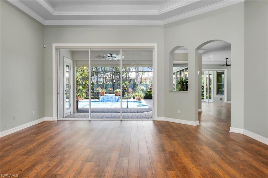 4956 Rustic Oaks Circle Naples, FL 34105 - Photo 36 of 37 a view of an entryway with wooden floor
