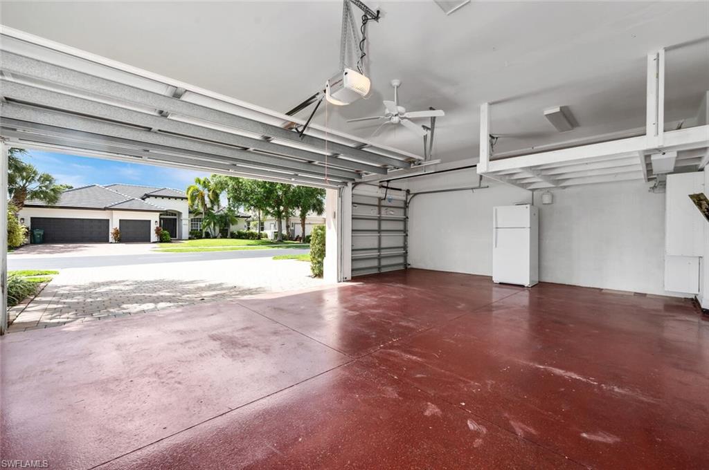 4956 Rustic Oaks Circle Naples, FL 34105 - Photo 37 of 37 a view of a room with windows and chandelier