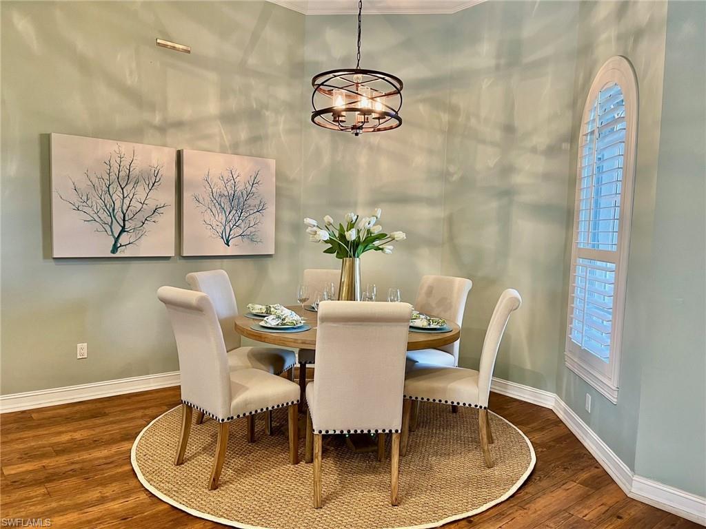 4956 Rustic Oaks Circle Naples, FL 34105 - Photo 9 of 37 a dining room with furniture and window