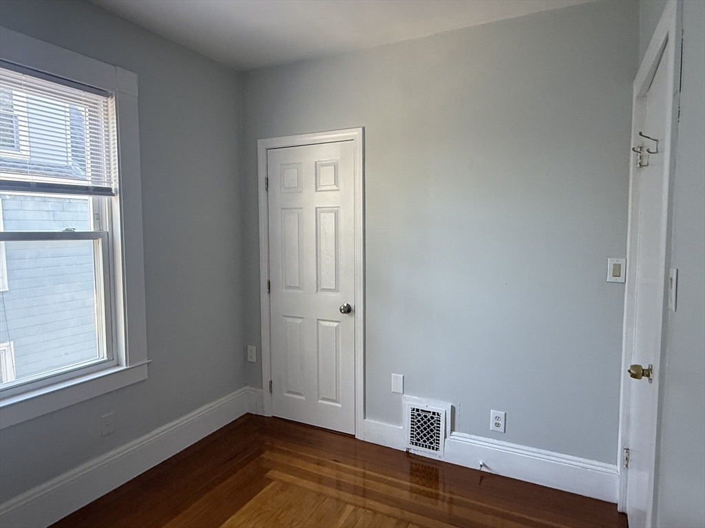 19-21 Dearborn Avenue, Unit 2 Lynn, MA 01905 - Photo 13 of 20 a view of room with window and wooden floor