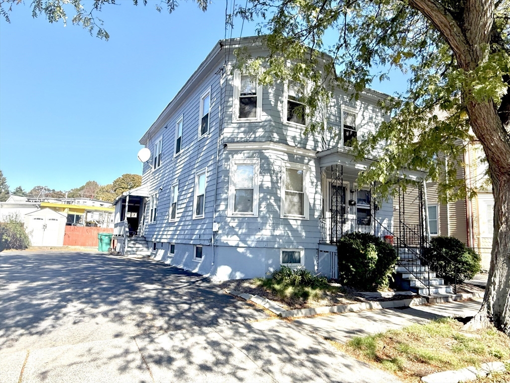 19-21 Dearborn Avenue, Unit 2 Lynn, MA 01905 - Photo 2 of 20 a view of a building with a yard