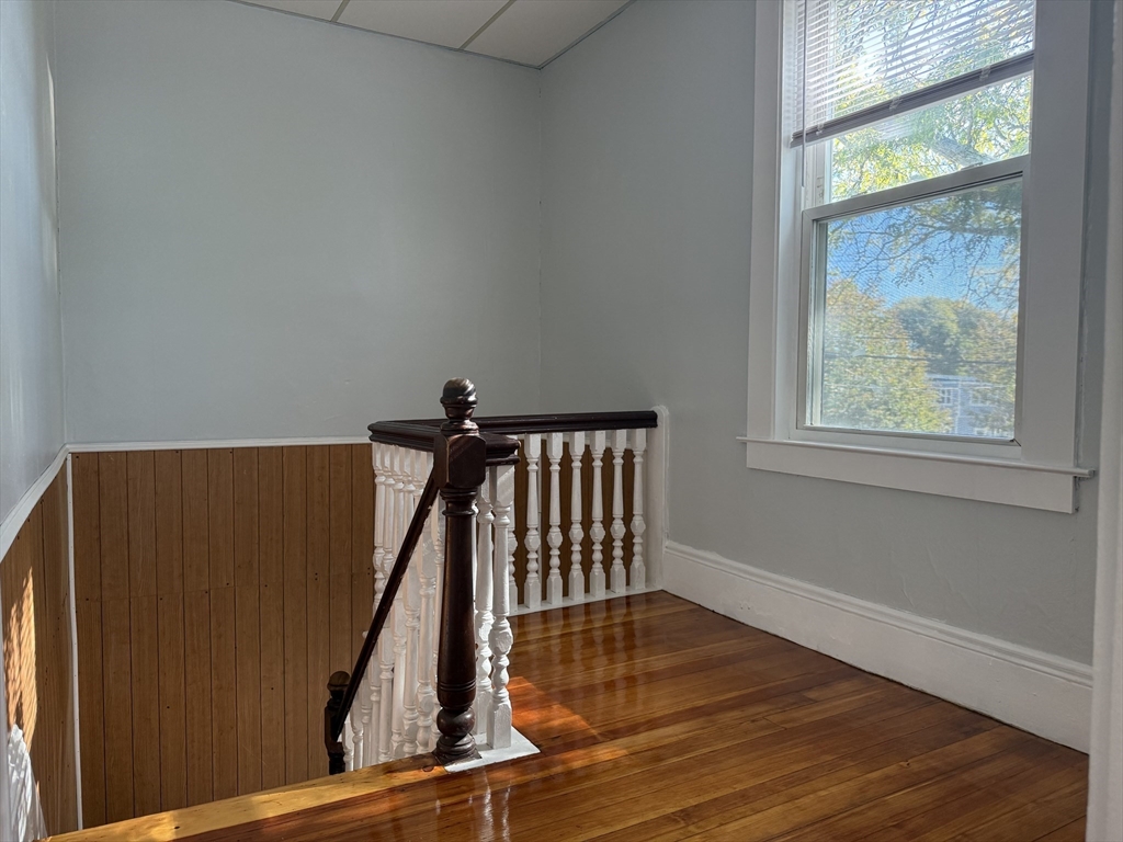 19-21 Dearborn Avenue, Unit 2 Lynn, MA 01905 - Photo 5 of 20 a view of staircase with wooden floor and a window
