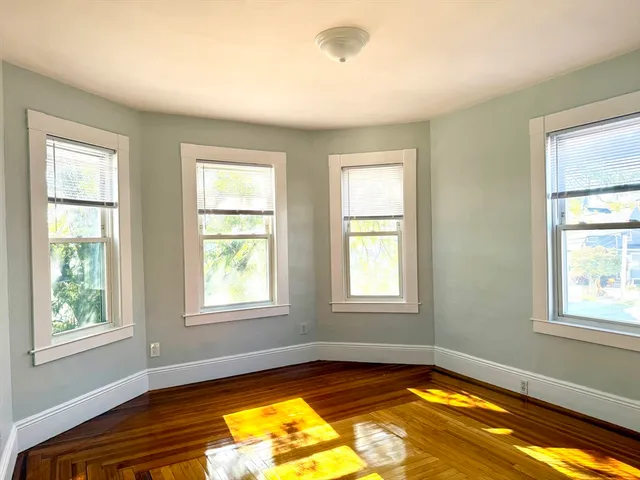 a view of a room with windows and dining area