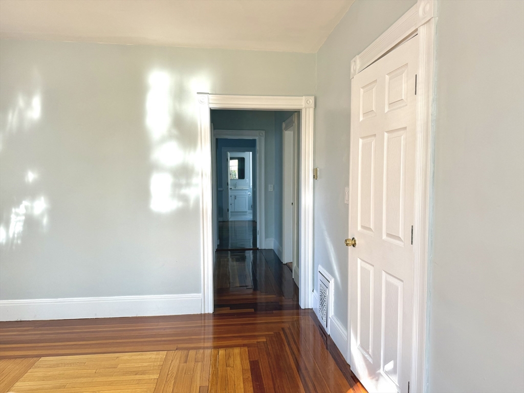 19-21 Dearborn Avenue, Unit 2 Lynn, MA 01905 - Photo 9 of 20 a view of a livingroom with wooden floor and a bathroom