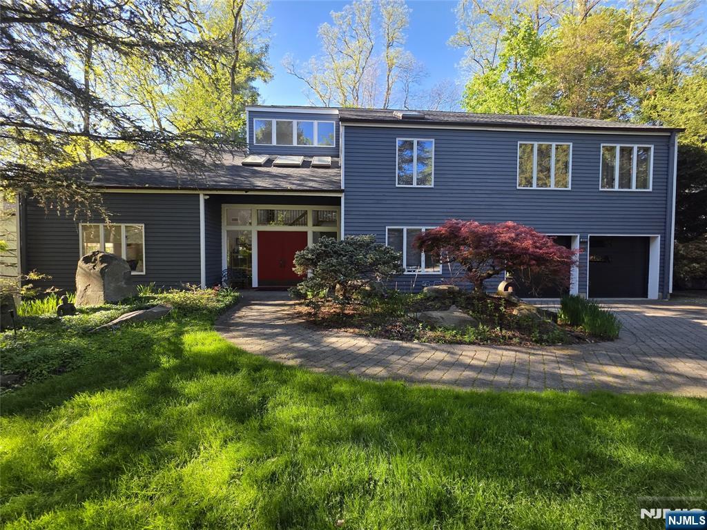 33 Cedar Lane Closter, NJ 07624 - Photo 1 of 44 a house view with a garden space