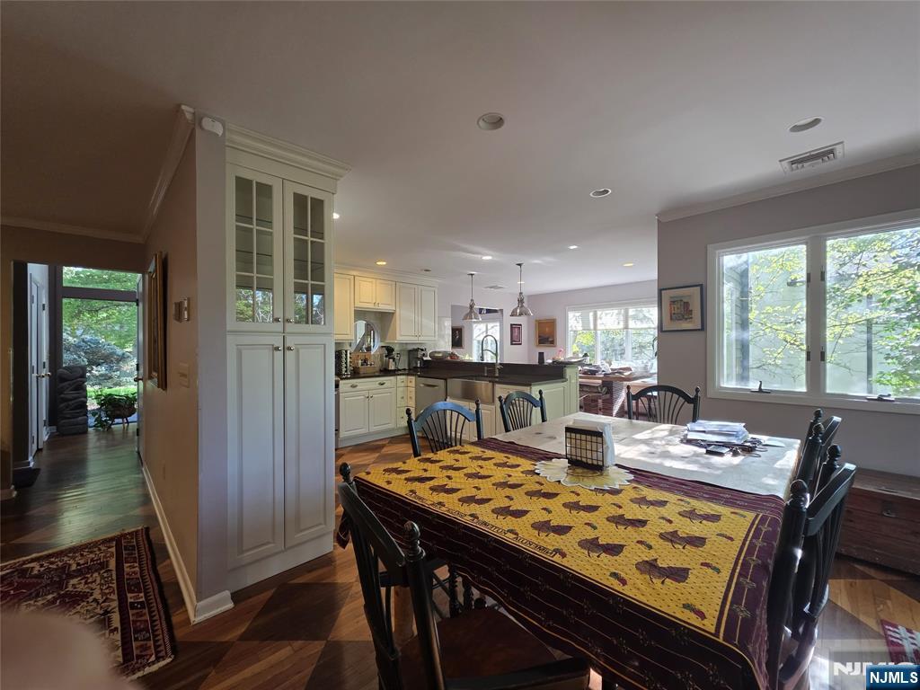 33 Cedar Lane Closter, NJ 07624 - Photo 21 of 44 a view of a dining room with furniture window and wooden floor