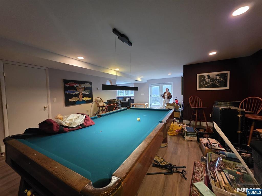 33 Cedar Lane Closter, NJ 07624 - Photo 34 of 44 a room with games and furniture
