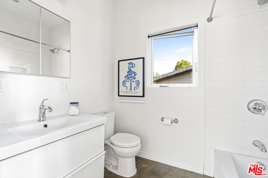 2275 Ewing Street Los Angeles, CA 90039 - Photo 13 of 19 a bathroom with a toilet sink and mirror