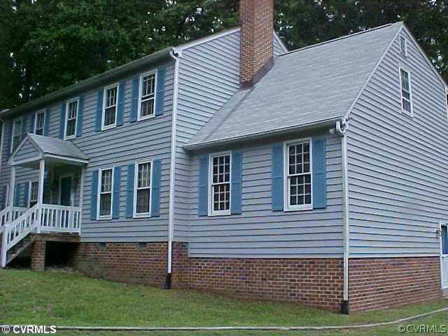 705 Fennimore Road Midlothian, VA 23114 - Photo 1 of 7 a front view of a house with a yard