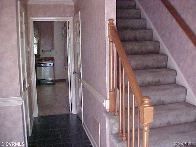 705 Fennimore Road Midlothian, VA 23114 - Photo 3 of 7 a view of a hallway with wooden floor and entryway