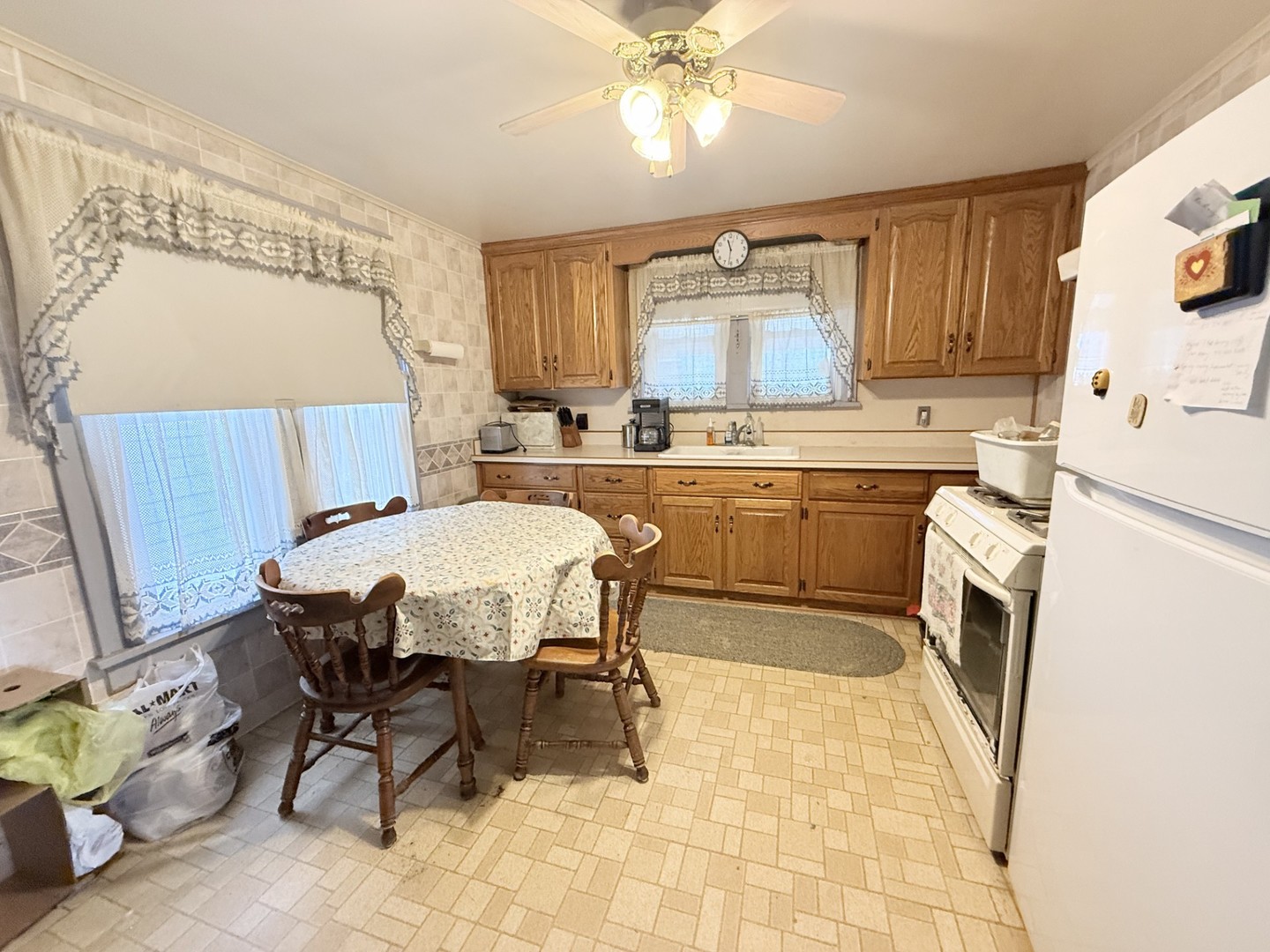 131 West Erie Street Spring Valley, IL 61362 - Photo 6 of 20 a kitchen with a sink cabinets and window
