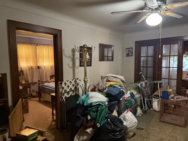 a bedroom with furniture and a window