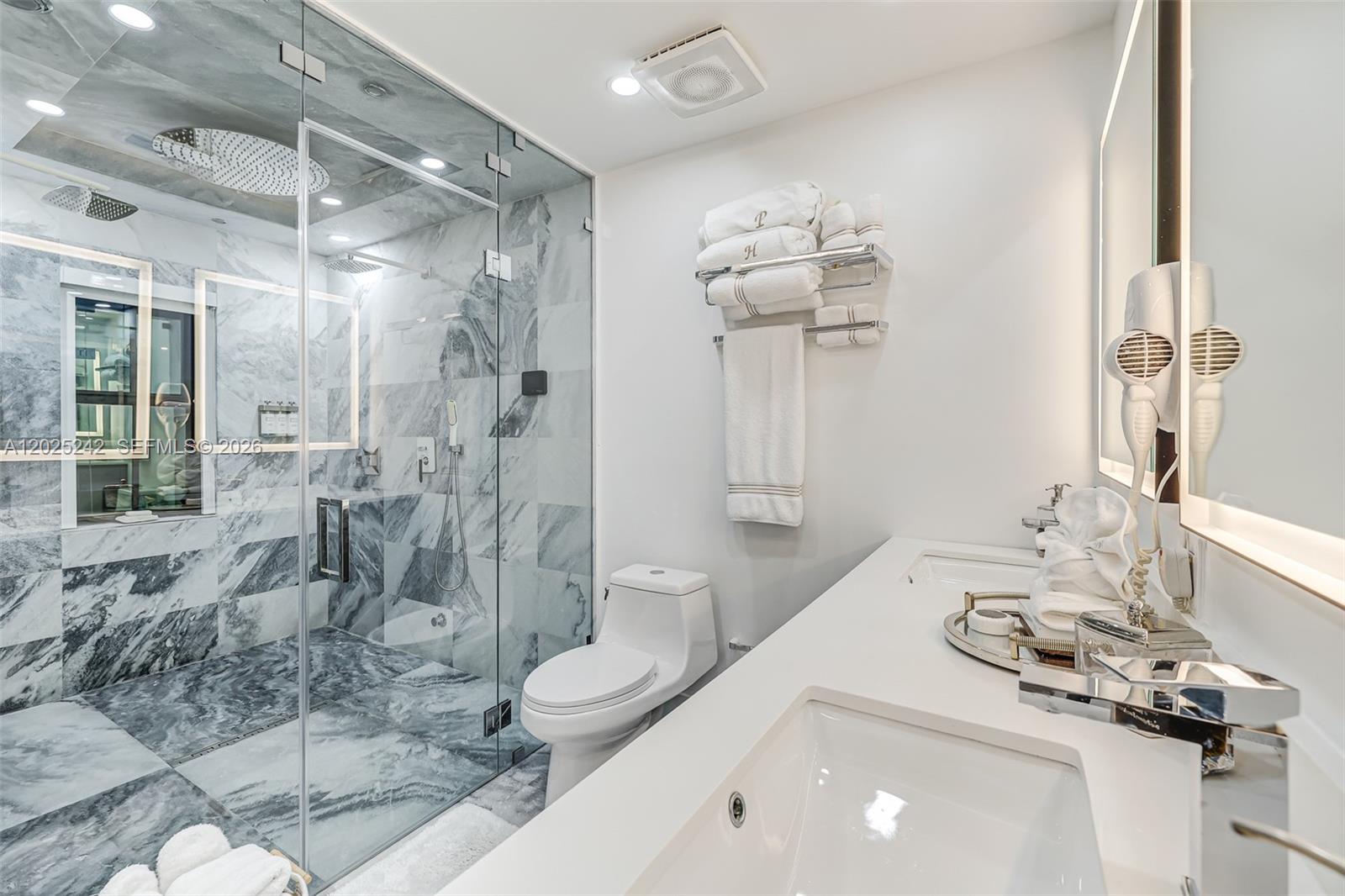 8761 Southwest 56th Street Miami, FL 33165 - Photo 50 of 90 a bathroom with a sink a toilet and shower