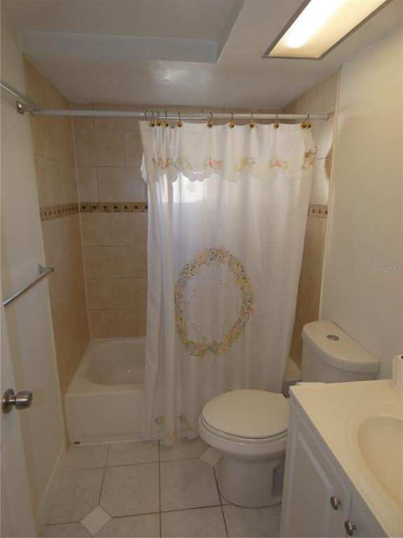 4832 Elmwood Street New Port Richey, FL 34653 - Photo 14 of 24 a bathroom with a shower a toilet and a sink