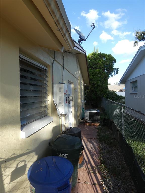 4832 Elmwood Street New Port Richey, FL 34653 - Photo 3 of 24 a view of a house with a yard