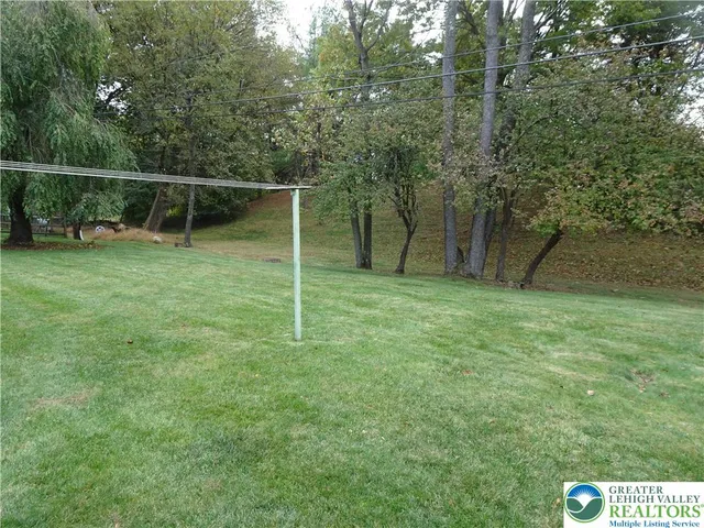 a backyard of a house with lots of green space