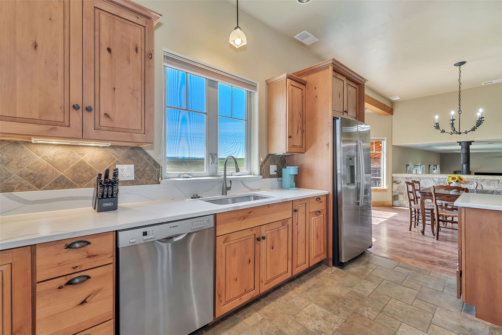 938 South Dry Creek Road Hayden, CO 81639 - Photo 16 of 34 a kitchen with stainless steel appliances granite countertop a refrigerator and a sink