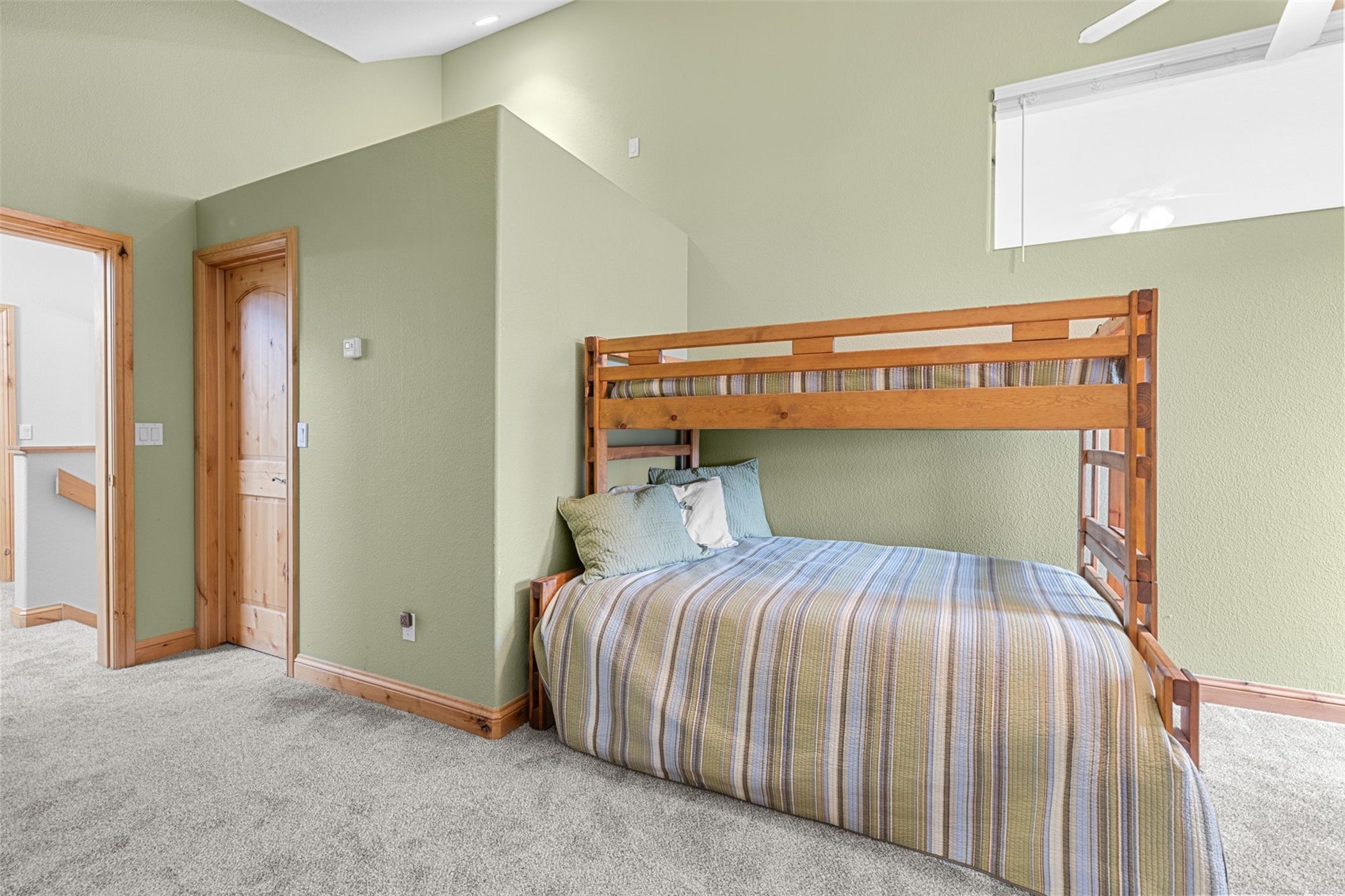 91795 Ryan Gulch Road Silverthorne, CO 80498 - Photo 34 of 50 a bedroom with a bed and a window