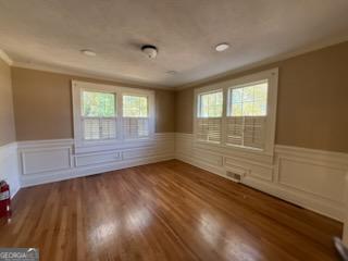952 Wayside Street Northwest Cornelia, GA 30531 - Photo 13 of 50 an empty room with wooden floor and windows