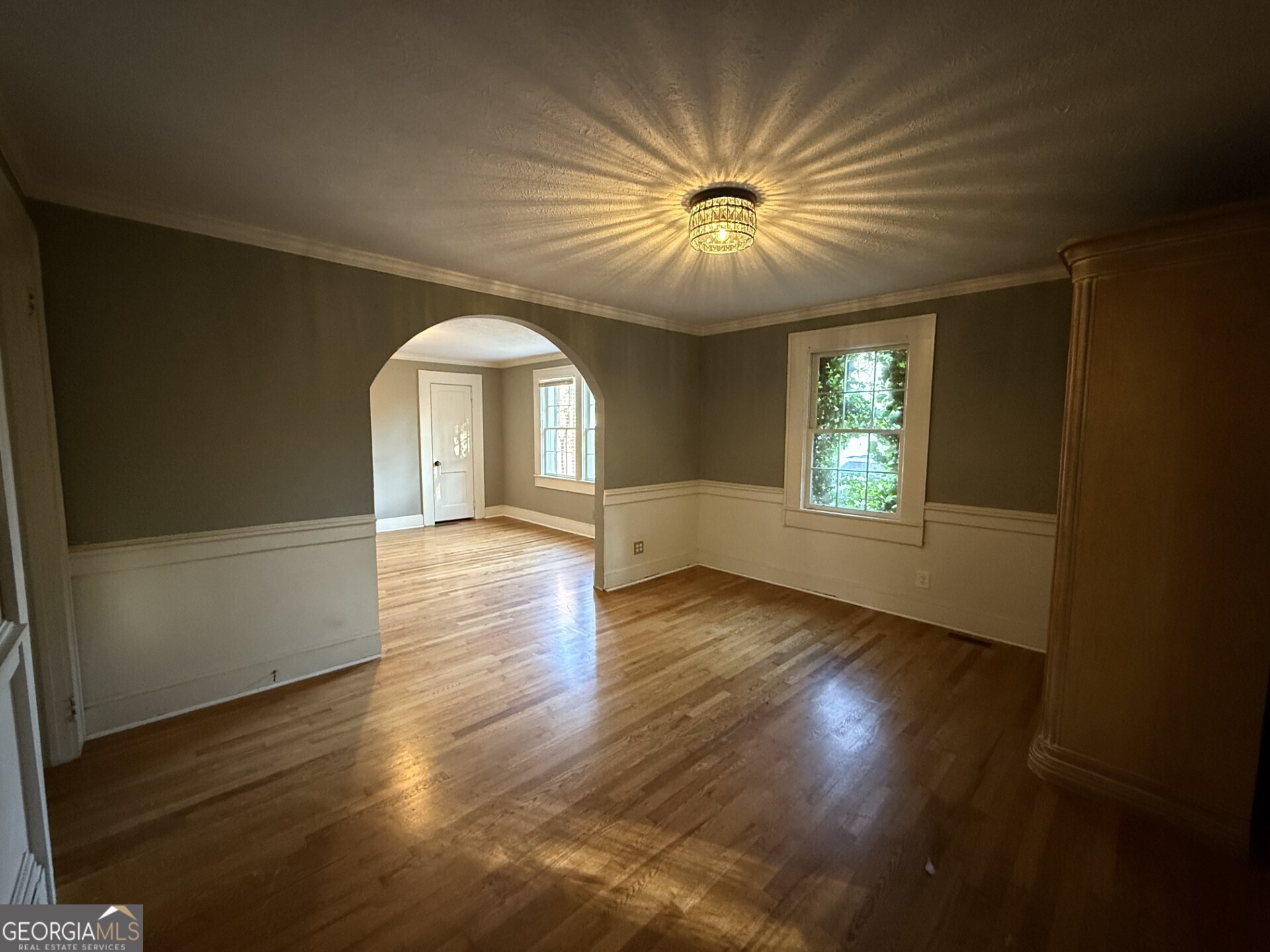 952 Wayside Street Northwest Cornelia, GA 30531 - Photo 22 of 50 an empty room with wooden floor fan and windows