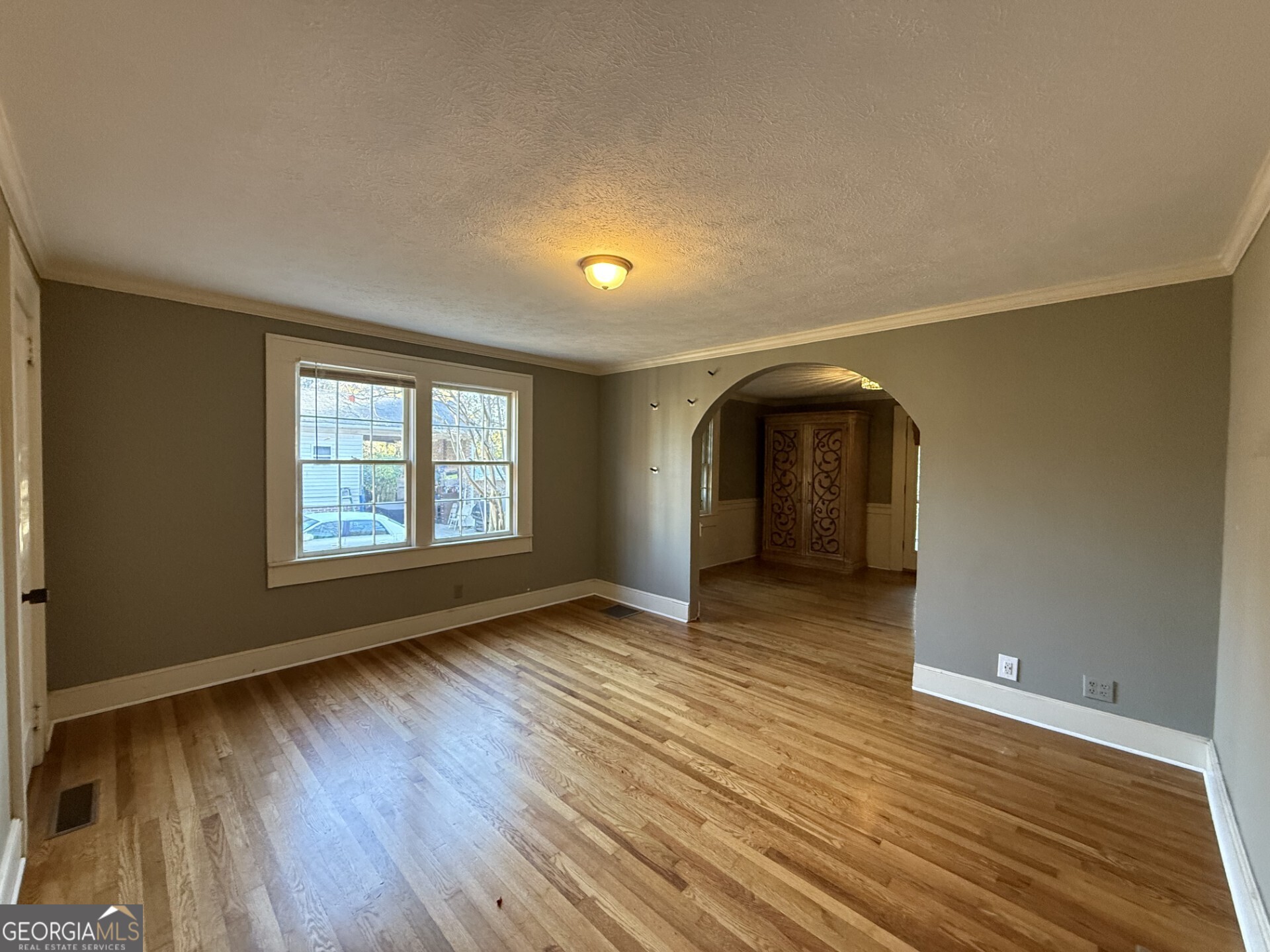 952 Wayside Street Northwest Cornelia, GA 30531 - Photo 24 of 50 an empty room with wooden floor and windows
