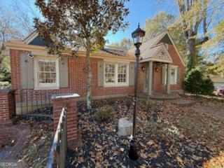 952 Wayside Street Northwest Cornelia, GA 30531 - Photo 5 of 50 a front view of a house with a yard