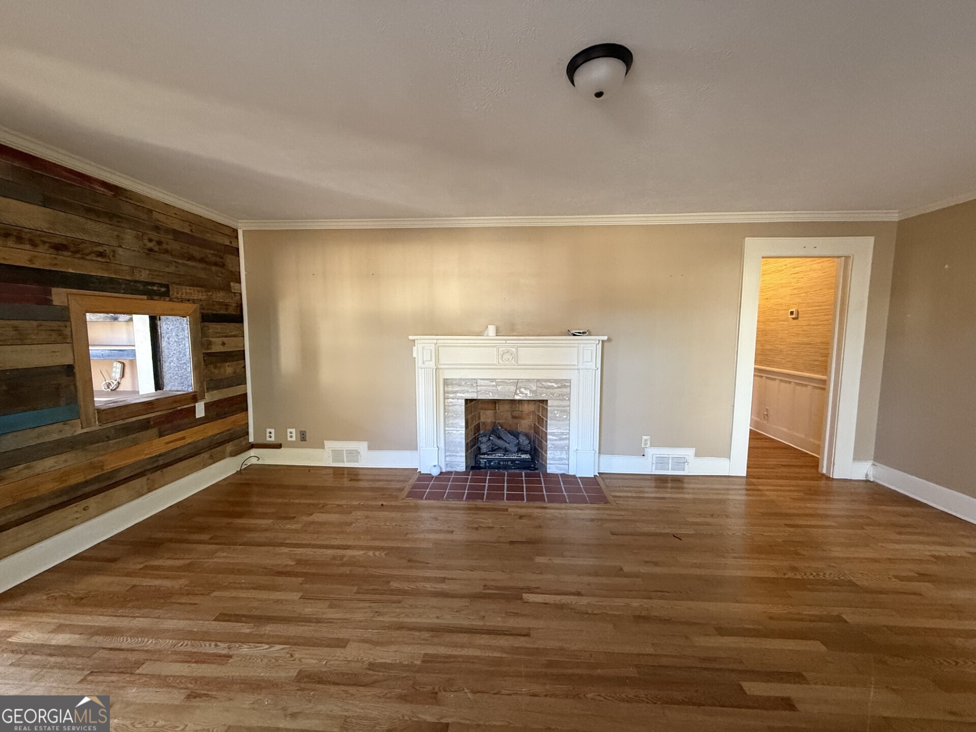952 Wayside Street Northwest Cornelia, GA 30531 - Photo 8 of 50 a view of an empty room with window and fire place