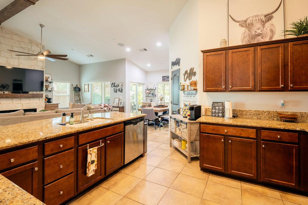 602 South Filbert Avenue Fresno, CA 93727 - Photo 15 of 50 a kitchen with stainless steel appliances granite countertop a sink counter space cabinets and a sink