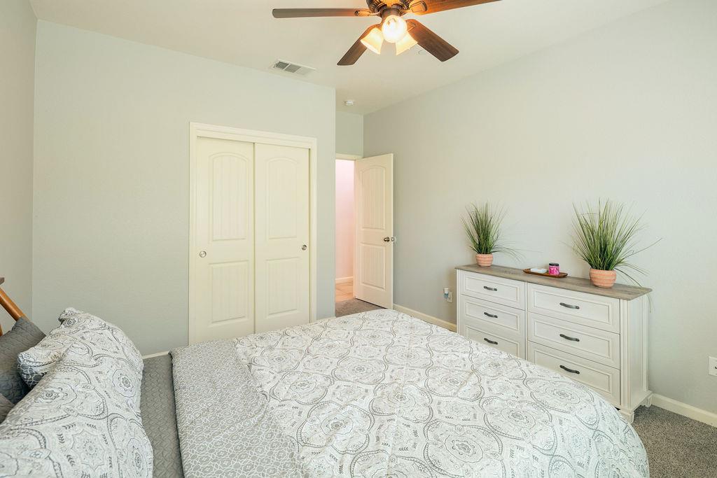 602 South Filbert Avenue Fresno, CA 93727 - Photo 22 of 50 a bedroom with a bed and a dresser