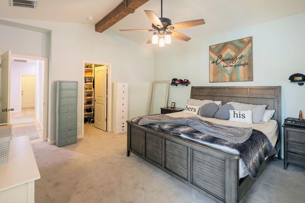 602 South Filbert Avenue Fresno, CA 93727 - Photo 31 of 50 a bedroom with a bed and a chandelier