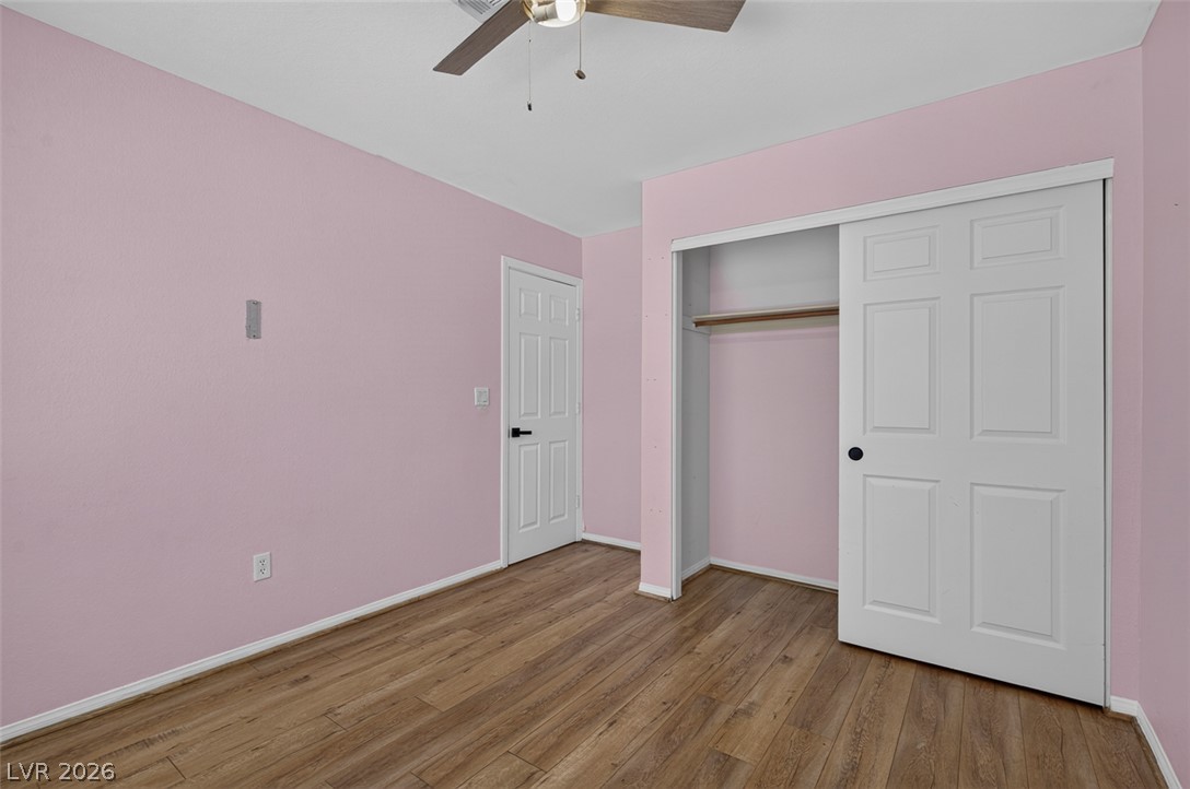 2609 Shakespeare Road Las Vegas, NV 89108 - Photo 26 of 41 Hardwood-style flooring and a ceiling fan create a comfortable atmosphere.