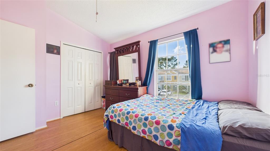 1250 Redondo Way Wesley Chapel, FL 33543 - Photo 17 of 27 a bedroom with a bed and a window