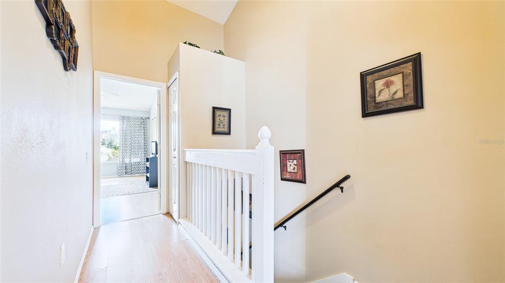 1250 Redondo Way Wesley Chapel, FL 33543 - Photo 19 of 27 a view of a hallway with wooden floor and entryway