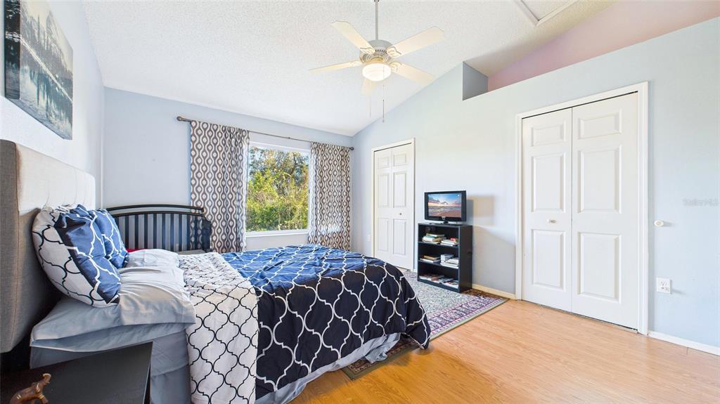 1250 Redondo Way Wesley Chapel, FL 33543 - Photo 22 of 27 a bedroom with a large bed and a window