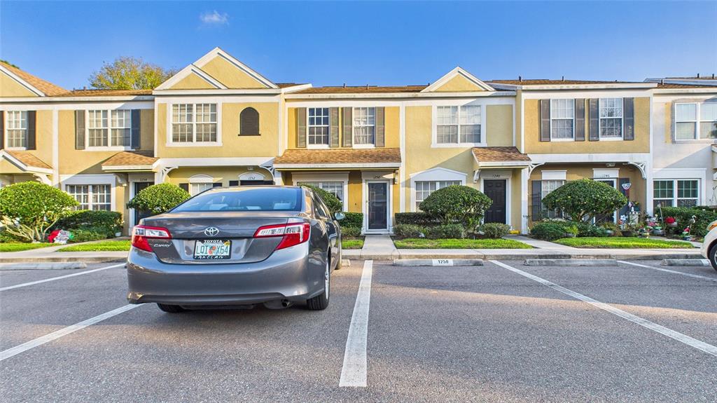 1250 Redondo Way Wesley Chapel, FL 33543 - Photo 25 of 27 a front view of a house with a yard