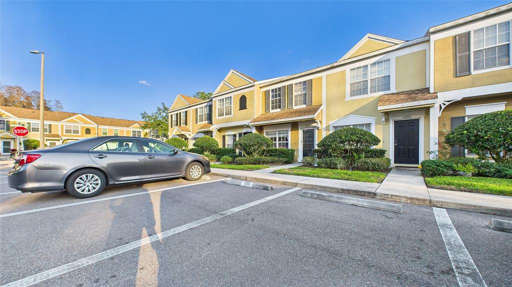 1250 Redondo Way Wesley Chapel, FL 33543 - Photo 26 of 27 a view of a car parked in front of a building