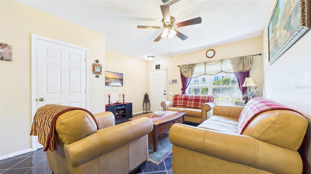 1250 Redondo Way Wesley Chapel, FL 33543 - Photo 8 of 27 a living room with furniture